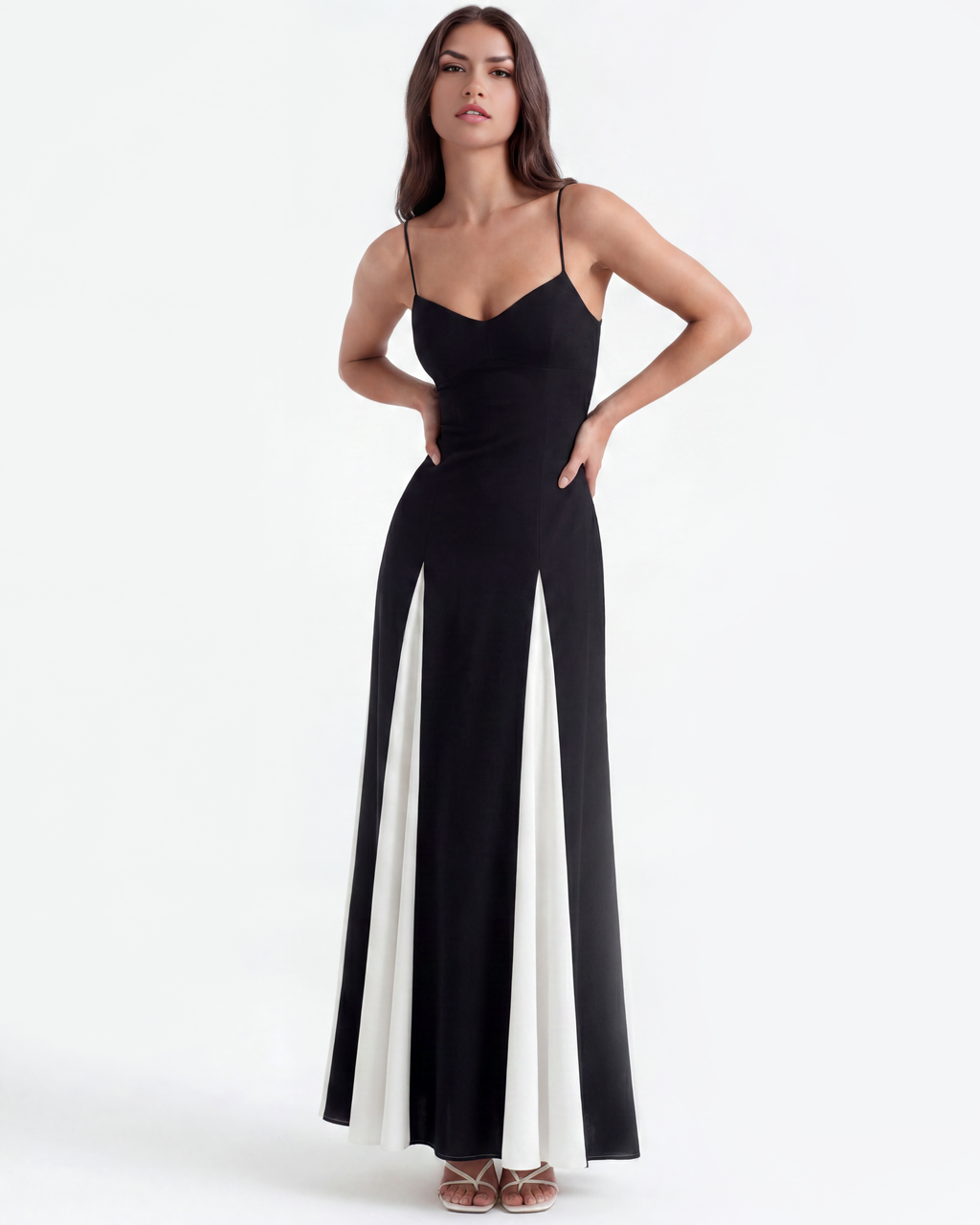 Black maxi dress with thin straps and V-neck, white side panels with slit look