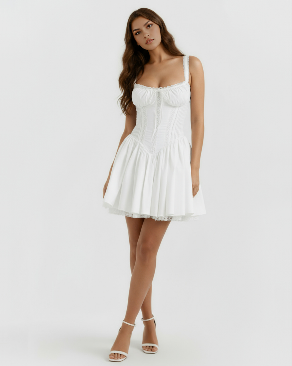 White mini corset dress with lace straps, bow-tied neckline, and flared skirt