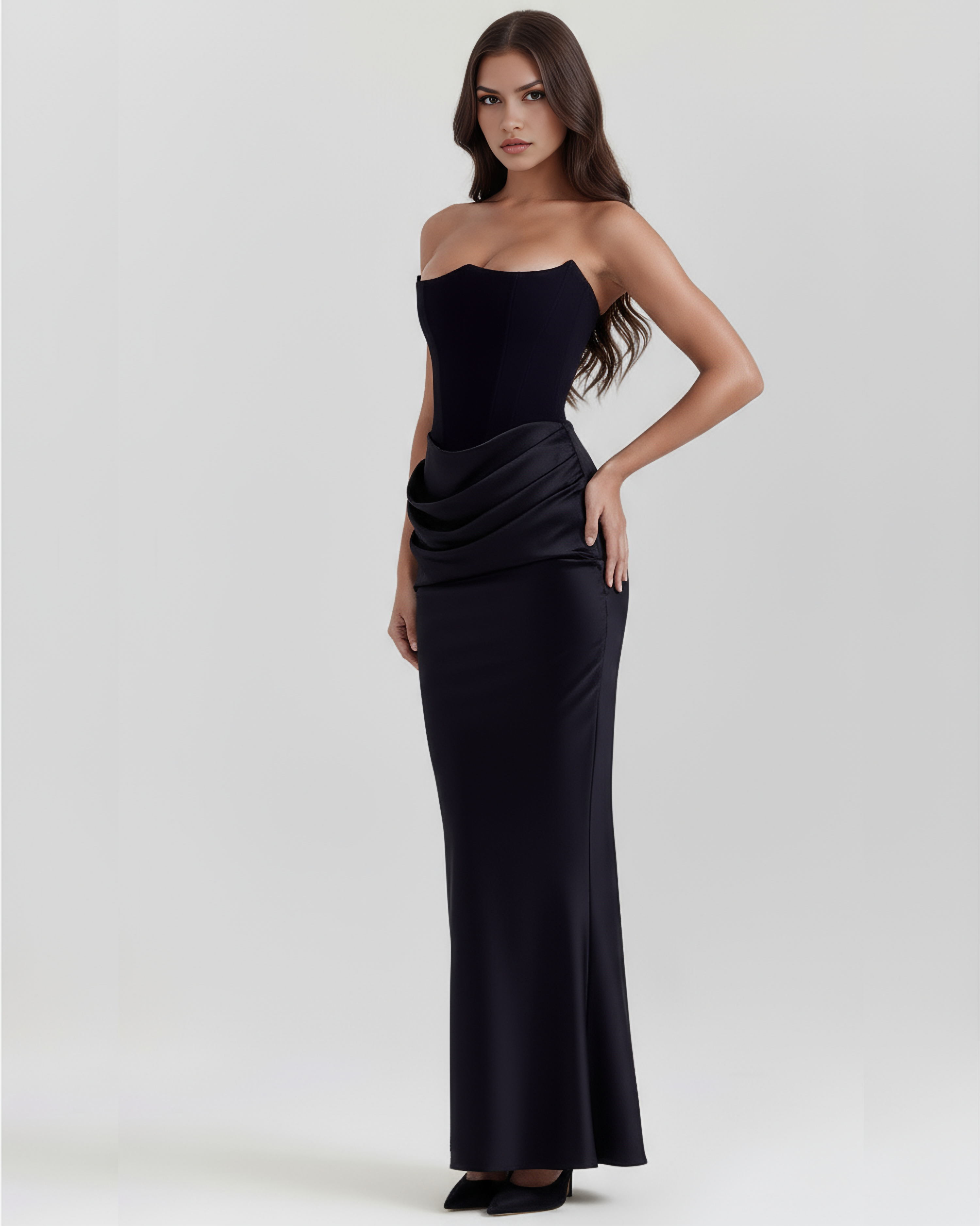 Black strapless fitted evening gown with wrapped drape at waist and long flared skirt