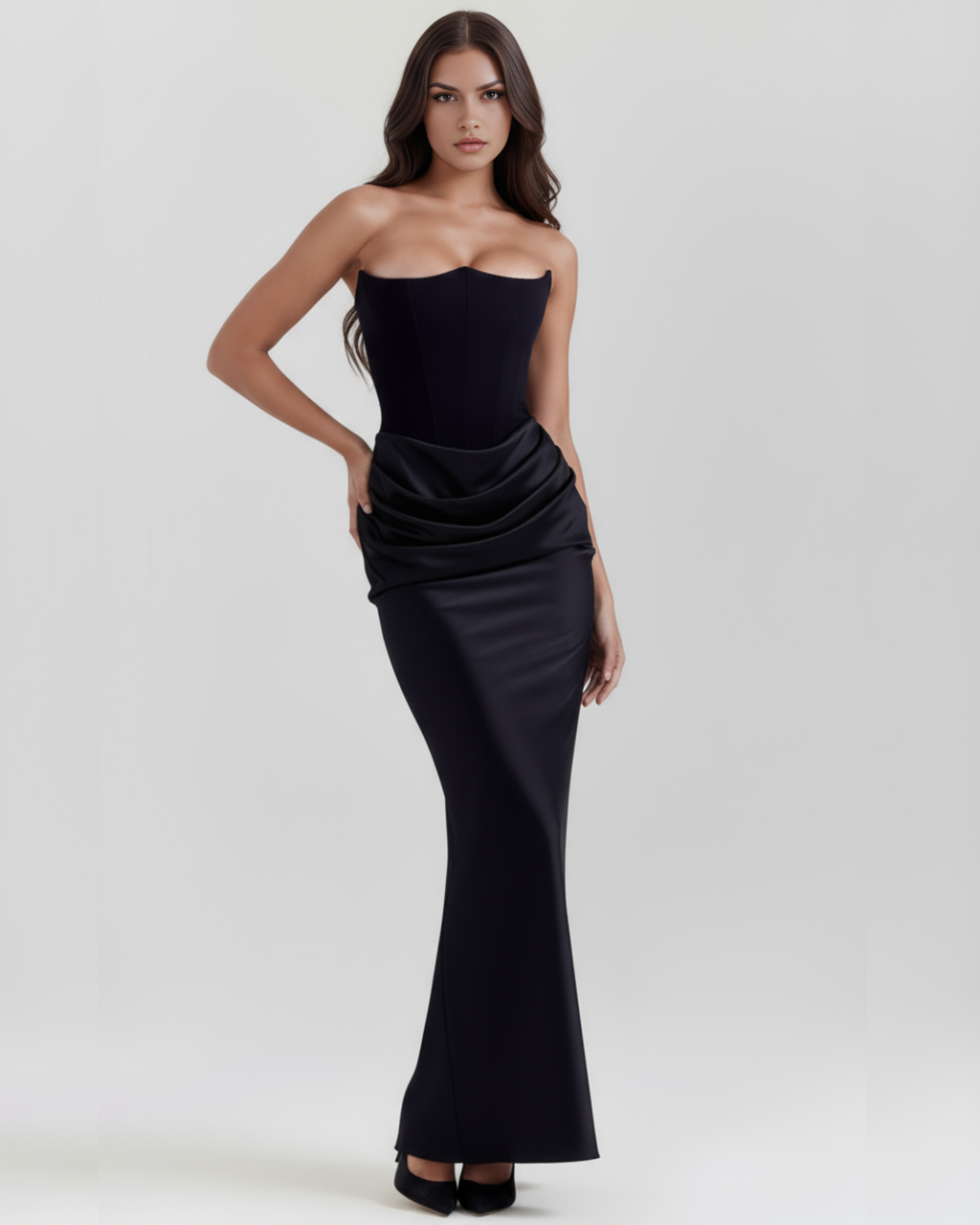 Black strapless fitted evening gown with draped waist detail and straight hem